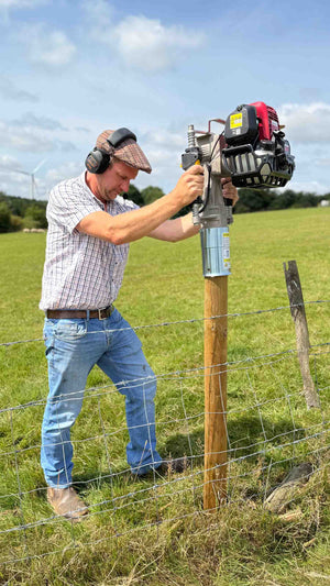Fenceline being repaired with 4" timber posts, using an Easy Petrol Post Driver