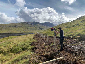 Post Driver being used to install a fence, with 75mm timber posts