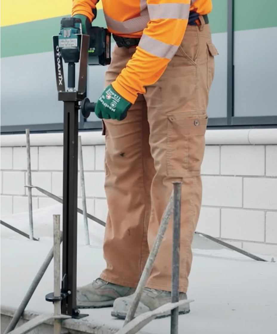 Removing road pins from poured concrete using Xtracto Tool