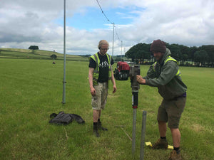 Post driver installing scaffold poles using the 78-54REDUCER